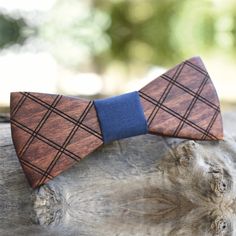 Wooden accessories are a must on every occasion. Either it's a formal event or your everyday look in question you definitely need strong and beautiful outlines. Our wooden bow ties are crafted with extreme care and finesse of high quality materials. Classic, modern, sassy or funny - we got it! This amazing bow tie is made of oak wood with an elaborate engraving and a cotton center piece. With an adjustable band up to 50cm. Dimensions 11X5cm. We give all our attention and care to making unique it Dapper Ties For Groom On Father's Day, Wooden Bow Tie, Wooden Bow, Wooden Accessories, Fabric Bows, Tie Accessories, Suit And Tie, Bow Ties, Gift For Men