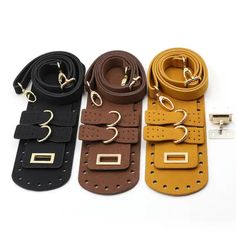 four different colored leather belts with metal buckles on each side and one has a gold clasp