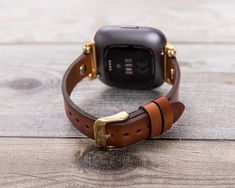 "Check Out Other Women Fitbit Versa Watch Bands Here👇👇 https://www.etsy.com/shop/LionKingLeather?ref=simple-shop-header-name&listing_id=799710984&section_id=28943732 Full Grain Leather Fitbit Watch Band Perfectly fits all Fitbit Versa 2, Versa Lite & Versa The band is compatible, without difficulty eliminated and attached in your clock mechanism. [Band Size] This watch band is medium size and fits between 150mm(5.9 inch) and 200mm (7.9 inch) wrists. Long Track: Wide: 0.86\" (2.2 cm Gold Leather Wrist Strap For Watches, Gold Leather Watch Strap, Brown Leather Strap For Watch Accessories, Adjustable Gold Leather Watch Bands, Gold Watch Accessories With Wrist Strap For Everyday Use, Gold Leather Watch Bands For Gifts, Gold Leather Watch Bands As Gift, Apple Watches For Women, Fitbit Versa 2