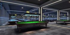 a room with pool tables and neon lights