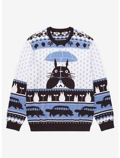 a blue and white sweater with an image of a cat holding an umbrella on it