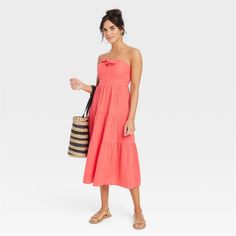 Move Through Sunny Days In Chic Style And Comfort With This Sleeveless Dress From Universal Thread. Made Of 100% Cotton Fabric With Lining For Comfy Wear, This Midi Strapless Dress Is Styled With A Flattering Knotted Front Neckline, Along With A Tiered Skirt. Plus, Side Pocket Adds Functional Flair To Your Look. Style With Your Go-To Sneakers For Weekend Errands Or Pair With Block-Heeled Mules For Coffee Catch-Ups. Sizing: Womens Material: 95% Cotton, 5% Recycled Cotton Garment Style: Sleeveless Midi Strapless Dress, Purple Summer Dress, Cotton Dress Fabric, Strapless Sundress, Red Strapless Dress, Blue Strapless Dress, White Strapless Dress, Midi Sundress, Strapless Floral Dress