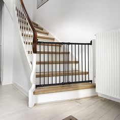 a stair case next to a white radiator