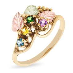 Celebrate Mom’s love for family with this exquisite customized ring from Black Hills Gold. Crafted in warm 10K gold, this ornate look showcases the two to six 2.5mm birthstones of your choice artfully set along a vine adorned with 12K green and rose gold leaf accents. Buffed to a brilliant luster, this ring captures her elegance. Black Hills Gold jewelry is manufactured in the Black Hills of South Dakota and keeps the traditional style from the 1870s of grape leaves, grape clusters and vines in the designs. Each item comes with a certificate of authenticity and is guaranteed against defects in workmanship. Gold Heirloom Birthstone Ring With Gemstone Accents, Heirloom Gold Birthstone Ring With Gemstone Accents, Rose Gold Leaf, Black Hills Gold Jewelry, Swirl Ring, Celebrate Mom, Black Hills Gold, Black Hills, Grape Leaves