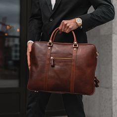 Finding a laptop bag that ticks all the boxes is not easy. We know what it's like. That's why we designed the City Large, a bigger brother of the City. A laptop bag so elegant it can easily accompany you to business meetings and casual enough that you'll want to have it with you every day. When carrying a laptop, functionality is key. But that doesn't mean you need to sacrifice style. City Large has a beautifully slim profile while its very spacious interior has been cleverly designed to fit a range of modern laptops and mobile devices, as well as books, documents, and even a compact lunch box, while keeping them nicely organized and safely secure. It includes a dedicated padded laptop compartment in the center, specially sized to accommodate laptops up to 14.5" in length, ensuring your de Modern Rectangular Laptop Bag For Workplace, Modern Rectangular Laptop Bag For The Workplace, Modern Briefcase With Laptop Sleeve For Workplace, Professional Laptop Bag With Sleeve, Professional Laptop Bag With Laptop Sleeve, Leather Laptop Bag For Men, Laptop Bag Men, Leather Laptop Bag, Work Style