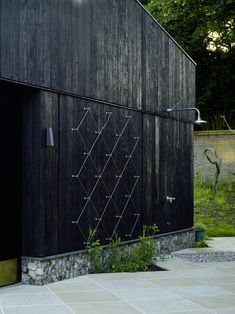 a black building with metal bars on the side