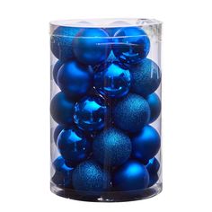 blue ornaments in a clear container on a white background