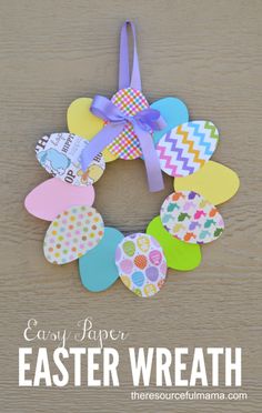 an easter wreath made out of paper with the words easy paper easter wreath on it