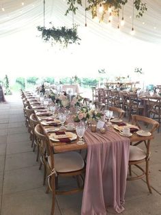 the tables are set up with place settings for guests to sit down and enjoy their meal