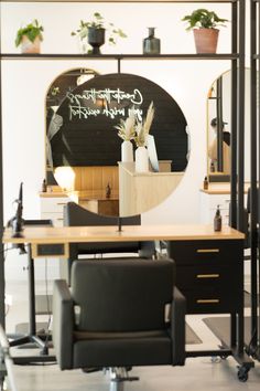 a mirror sitting on top of a desk next to a chair