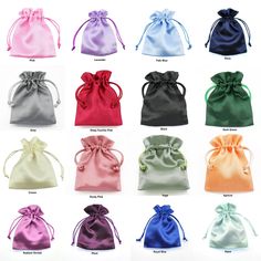 various colors of satin bags with bows on the front and side, all in different sizes