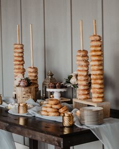 a table with donuts and candles on it