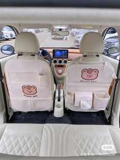 two seats in the back of a car with an animal motif on one side and a monkey design on the other