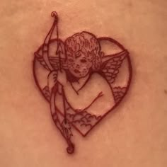 a tattoo with an image of a cupid holding a bow and arrow in the shape of a heart