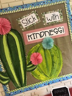 a bulletin board with a green cactus and pink flowers on it that says stick with kindness