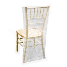 a chair with a white cover over it and a wooden seat on the back side