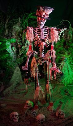 a skeleton is standing in the middle of some plants and grass with other skulls around it