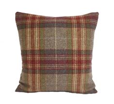 a brown plaid pillow on a white background with a red and green checkered pattern