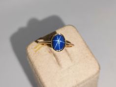 Band: Aarohi Jewellers Material : 14k Yellow Gold Gemstone :Lab Blue Star Sapphire  Blue Sapphire  Stone Weight : 2.20 Ct Blue Sapphire Stone Size : 8x6 mm Gross Weight : 1.400 Gm Style: Minimalist All of our Jewelry is handmade with great care by our team.  Thank you for visiting our store.  https://www.etsy.com/your/shops/Aarohijewellers/tools/listings/create Gold Sapphire Ring Star, Sapphire Gold Ring, Gold Ring Stacking, Star Sapphire Ring, Blue Star Sapphire, Ring Gifts, Star Sapphire, Ring Stacking, Pretty Jewelry