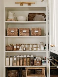 an organized pantry with baskets and food items