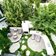 an aerial view of a backyard with furniture and trees