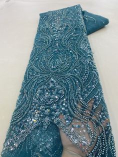 This high quality Fabric is measured in 5 Yards With Embroidered Beading and Sequin. It is soft, very delicate and beautiful. This high Quality Fabric is made with Fashion embroidered rhinestones can be used in making party wedding dresses, skirts, shawls, scarves and other other fashion apparels as you would like. Size : Length : 5 yards (180 inch). Width: 50 inch (Please allow slight deviation for the measurement data ,±1 inch) Material: 100% Polyester, Tulle Lace Fabric, Eco-Friendly embroide Hand Beaded Lace, Beaded Lace Fabric, Nigerian Lace, Embroidered Lace Fabric, Bridal Fabric, African Lace, Fabric Beads, Handmade Fabric, Sequin Beading