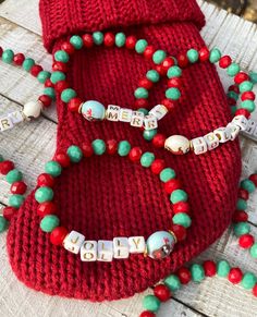 This dainty bracelet is a fun and colorful way to show your festive, Christmas spirit. Composed of faceted green and red glass beads, gold brushed metal spacers, a cute reindeer or sled acrylic bead and the (acrylic) letters spelling either 'jolly' or 'merry.' This bracelet is super fun to wear alone, to layer with others and makes a terrific gift too!! One size fits most. Listing is for 1 bracelet, you choose the style. View more from this shop here: https://www.etsy.com/shop/uniquebeadingbyme? Multicolor Christmas Gift Bracelets, Personalized Beaded Bracelets For Christmas Gift, Red Beaded Bracelets For Christmas Gifts, Red Christmas Bracelets For The Holidays, Red Christmas Bracelets For Holiday, Christmas Gift Beaded Bracelets With Letter Beads, Red Christmas Bracelet For Holiday, Red Christmas Festive Bracelets, Christmas Gift Beaded Bracelet With Letter Beads