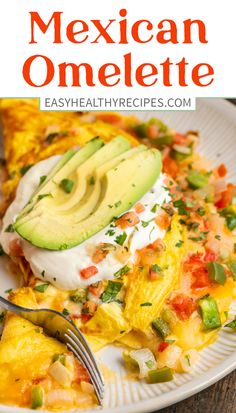 mexican omelette on a white plate with avocado and sour cream sauce