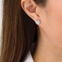 Experience the whimsy of these charming diamond flower stud earrings. Created in sterling silver, each delightful earring showcases a petite diamond - artfully set to enhance size and sparkle. Surrounding the center, pointed petal shapes shimmer with diamonds. Captivating with 1/6 ct. t.w. of diamonds and a bright polished shine, these post earrings secure comfortably with friction backs. Diamond White Brilliant Cut Flower Earrings As Gift, Fine Jewelry Brilliant Cut Cubic Zirconia Flower Earrings, Fine Jewelry Flower Earrings With Brilliant Cut Cubic Zirconia, White Diamond Accented Flower Earrings, White Flower Earrings With Diamond Accents, Diamond White Brilliant Cut Flower Earrings, Diamond White Flower Earrings With Cubic Zirconia, White Brilliant Cut Cubic Zirconia Flower Earrings, White Cubic Zirconia Flower Earrings With Brilliant Cut