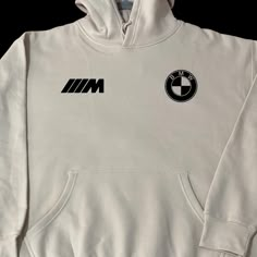 BMW M Hoodie. The Bimmer lovers hoodie - Cozy and great material hoodie - Free Shipping & hoodies are automatically express shipping (delivery time 2-4 days) except out of US can take up to 1+ weeks - Hoodies are unisex US sizes Design Front: BMW Logo & M Logo Back: BMW Car with BMW logo Bmw Hoodie Design, Bmw Tshirt Design, Bmw T Shirt Design, Bmw Car Accessories, Car Hoodie Design, Cool Sweatshirt Designs, Bmw Clothing, Bmw Sweatshirt, Bmw Hoodie