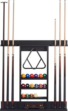 a rack with pool balls and cues in it