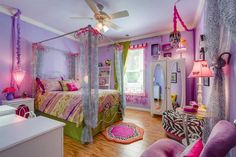 a bedroom decorated in pink, green and purple