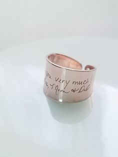 "Actual handwriting ring, custom handwritten ring, engraved signature ring, adjustable name ring memorial jewelry, Personalized keepsake gift. Memorial keepsake gift that makes a big impact in such an affordable price :) Ring made with Rhodium plated brass and available in 16k gold, silver and rose gold plated. The ring is an open cuff adjustable design, and will best fit US sizes 6.25 through 7.25. Measurement: ** Ring width is about 0.55\" (14 mm). ** Thickness of ring is about 0.04\" ( 1 mm). Handwriting Ring, Handwritten Ring, Handwritten Jewelry, Signature Ring, Signature Rings, Name Ring, Name Rings, Jewelry Personalized, Personalized Rings