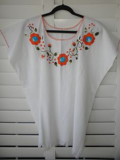 "Width - 30\" shoulder-to-shoulder; Length - 26\" long (Large/Extra Large) 100% Manta (cotton material that wears like a linen). Great for hot weather. Hand-wash or turn inside-out on your machine's delicate cycle Ask me about international shipping!" Orange Floral Embroidery Short Sleeve Tops, Orange Floral Embroidered Short Sleeve Tops, Orange Short Sleeve Tops With Floral Embroidery, Orange Embroidered Cotton Blouse, Summer Embroidered Orange Blouse, Orange Cotton Blouse With Floral Embroidery, Orange Bohemian Top With Floral Embroidery, Orange Embroidered Summer Blouse, Summer Orange Embroidered Blouse