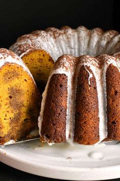 a bundt cake with white icing on a plate