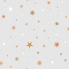 gold and white stars are flying in the air on a light gray background with silver foil