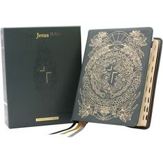 a book with a cross on the front and an ornate design on the back cover