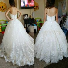 two women in wedding dresses looking at each other