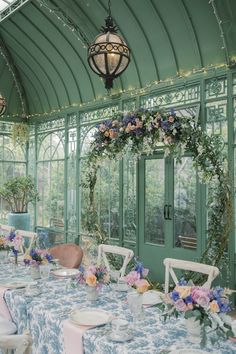 a long table with blue and white cloths is set up for a formal function