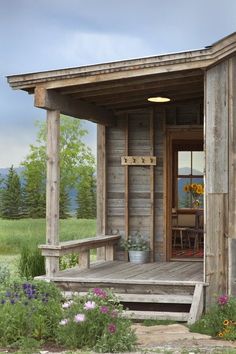 a painting of a small wooden cabin with flowers in the foreground