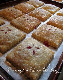 several square pastries are on a baking sheet