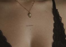 a close up of a woman's chest with the word love written on it