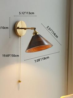 an image of a wall light with measurements for it's size and height on the wall