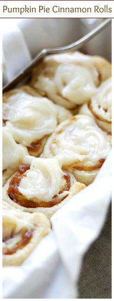 a pan filled with pumpkin pie cinnamon rolls