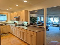 an empty kitchen and living room in a house