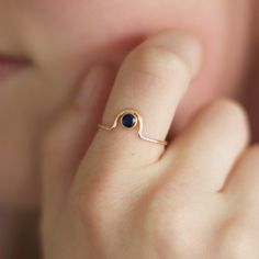 "This unique gemstone ring is the perfect addition to any stack! It is also available in every birthstone which makes it an ideal gift for any jewelry lover! The gemstones in the pictures feature a pink ruby (July birthstone) and blue sapphire (Sept birthstone). This ring is made with a 4mm gemstone and the metal options are: 14k gold filled, 14k rose gold filled, sterling silver, solid 14k yellow gold or solid 14k rose gold. You can select your preference via the drop down menu before adding it Jewellery Styling, Donut Jewelry, Pascal Campion, Birthstone Stacking Rings, Mothers Ring, Dot Ring, Pink Ruby, Mother Rings, Birthday Ring