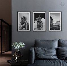 three black and white pictures hang on the wall above a couch in a living room