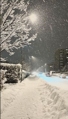 a person riding skis down a snow covered street