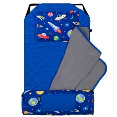 a blue sleeping bag with outer space designs on it, and a gray blanket folded over the top