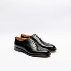 Black calf oxford shoe with stitched cap toe, leather inner lining and insole, Goodyear welted, single leather sole. Fitting G, last 173. Made in England Business Lace-up Cap Toe Shoes With Goodyear Welting, Classic Cap Toe Business Lace-up Shoes, Formal Lace-up Shoes With Goodyear Welted Cap Toe, Classic Oxford Lace-up Shoes With Rubber Heel Cap, Formal Lace-up Shoes With Goodyear Welt And Cap Toe, Business Lace-up Shoes With Rubber Sole And Cap Toe, Cap Toe Oxfords For Derby, Fitted Cap Toe Oxfords For Derby, Timeless Plain Toe Oxford For Derby